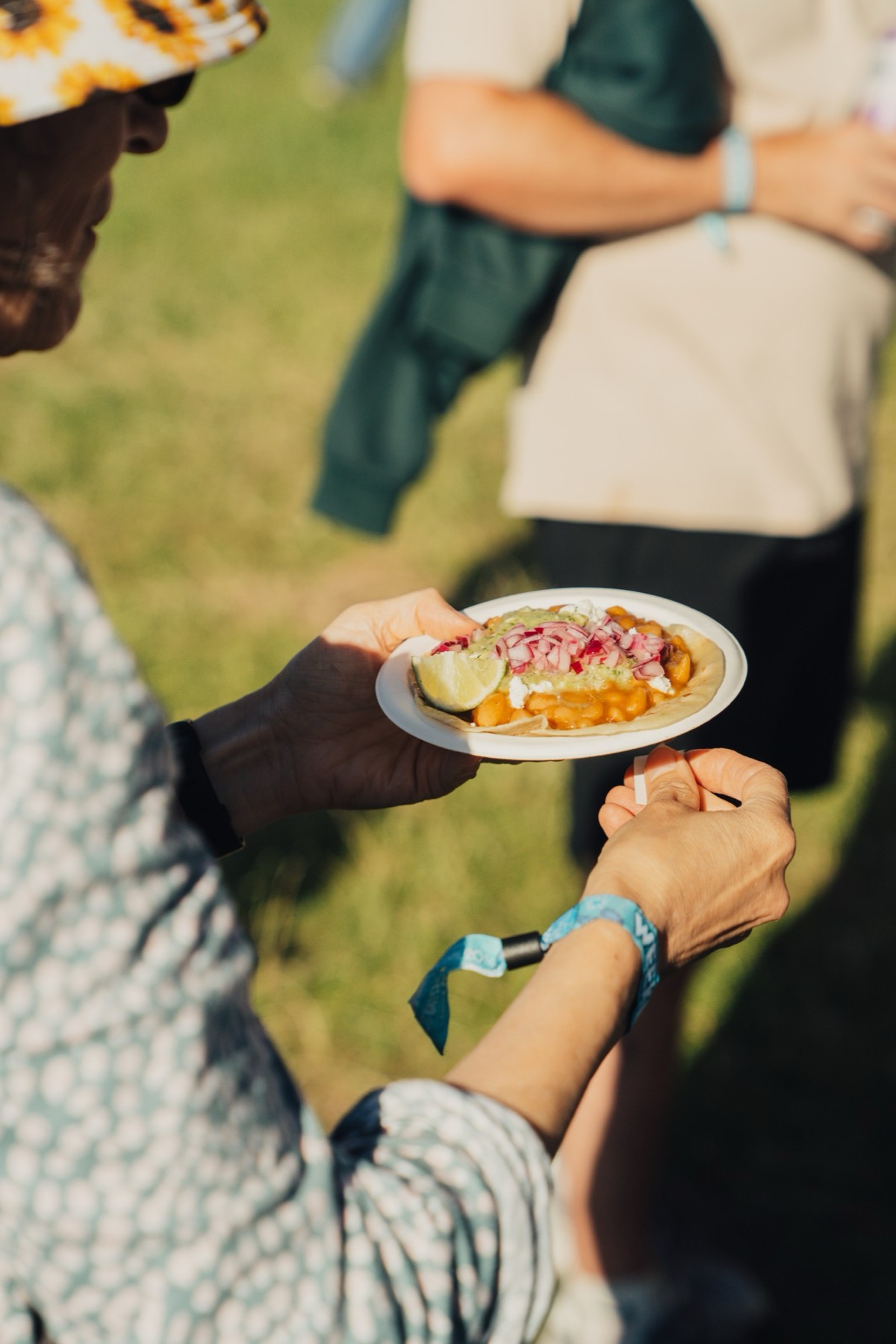 A frijoles taco with pickled red onion, guacamole and feta.